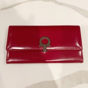 Salvatore Ferragamo red leather wallet.